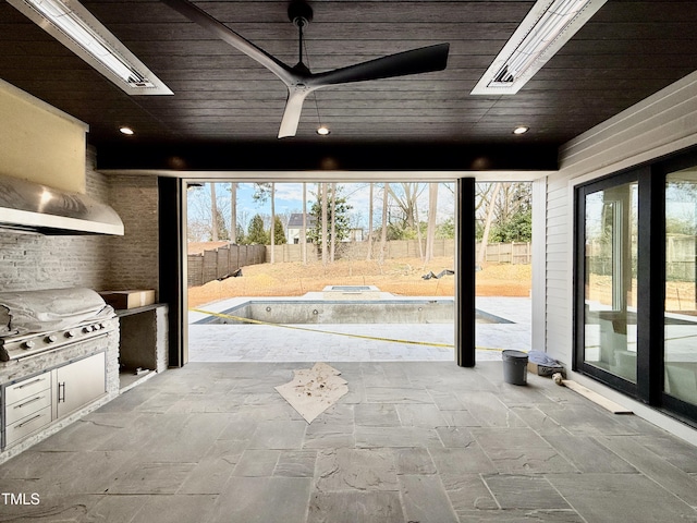 view of patio with an outdoor kitchen, area for grilling, and ceiling fan