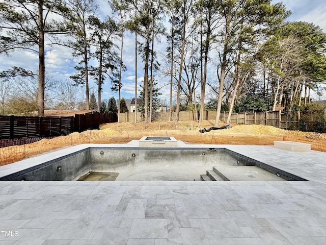 view of pool featuring a patio area and an in ground hot tub