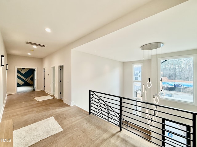 corridor featuring light hardwood / wood-style flooring