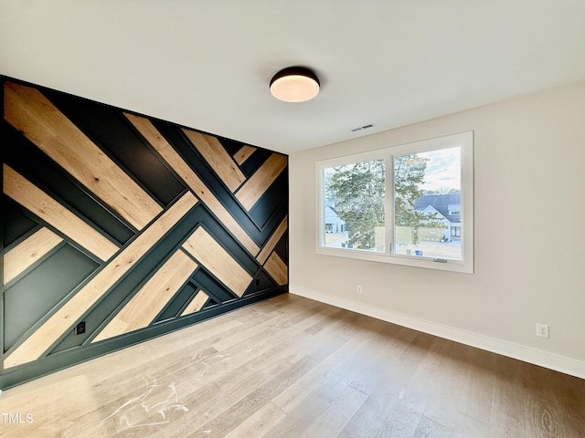 empty room featuring hardwood / wood-style floors