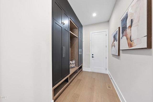 mudroom featuring recessed lighting, light wood-type flooring, visible vents, and baseboards