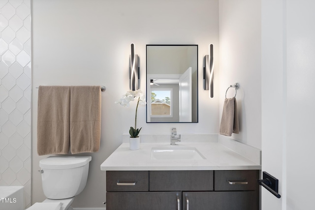 bathroom featuring toilet and vanity