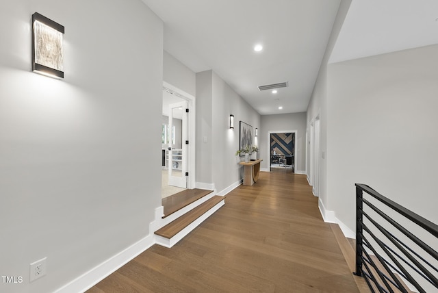 662 Manchester Dr, Raleigh, NC 27609 - hallway with wood finished floors, baseboards, and recessed lighting