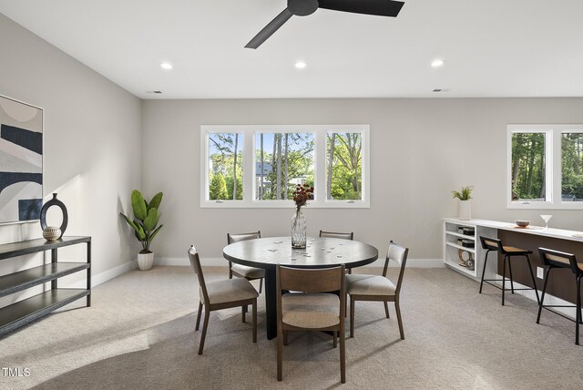 662 Manchester Dr, Raleigh, NC 27609 - dining room featuring ceiling fan, plenty of natural light, light colored carpet, and recessed lighting