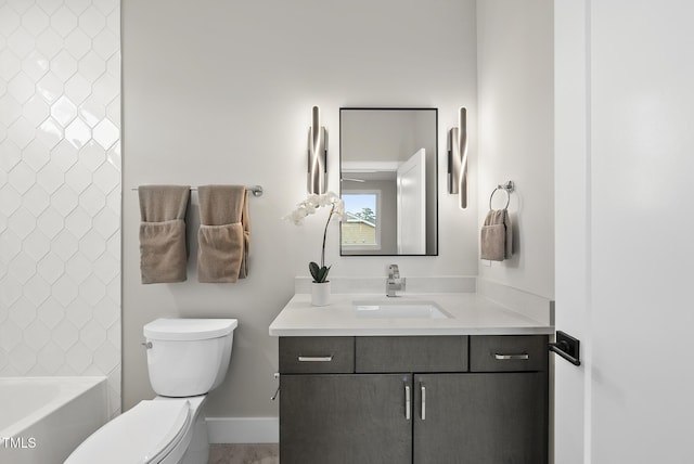 662 Manchester Dr, Raleigh, NC 27609 - bathroom featuring toilet, vanity, and baseboards