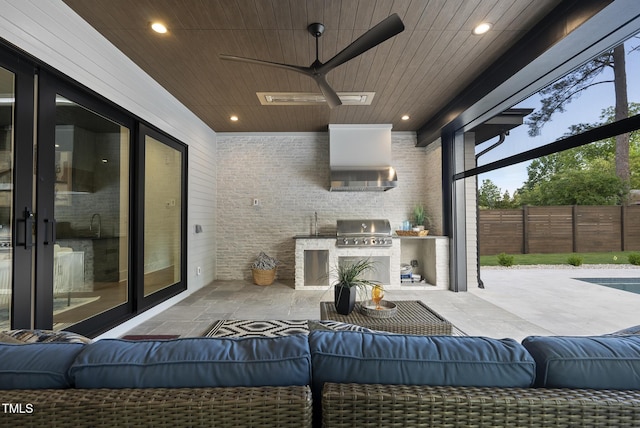 662 Manchester Dr, Raleigh, NC 27609 - view of patio / terrace featuring an outdoor kitchen, an outdoor hangout area, area for grilling, fence, and a ceiling fan