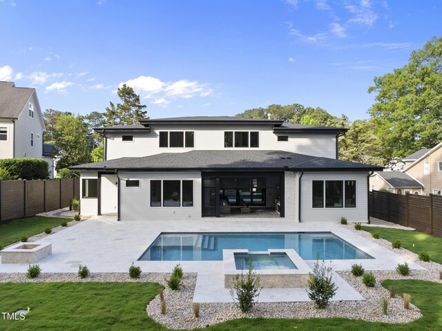 662 Manchester Dr, Raleigh, NC 27609 - back of house featuring a patio, a pool with connected hot tub, and a fire pit