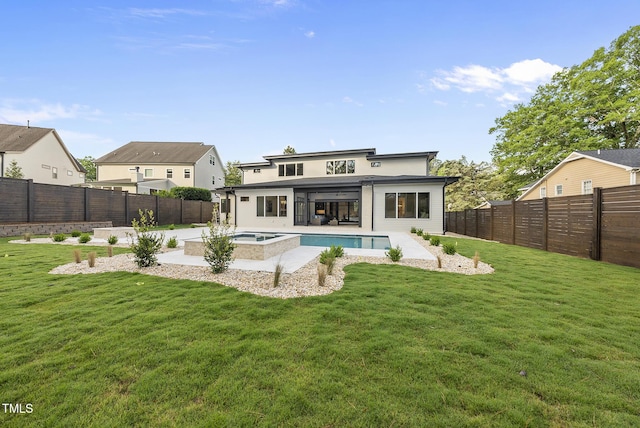 662 Manchester Dr, Raleigh, NC 27609 - rear view of house with a pool with connected hot tub and a patio