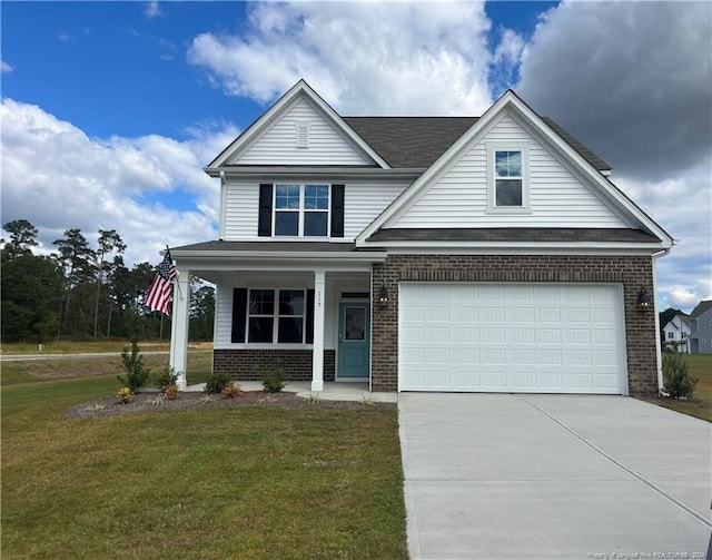 view of front of house with a front yard and covered porch