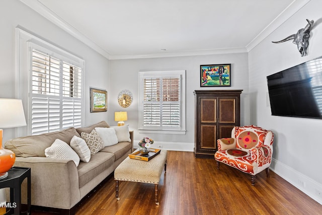 living area with ornamental molding, dark wood-style flooring, and a wealth of natural light