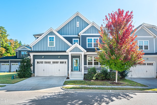 view of front of property featuring a garage and a front lawn