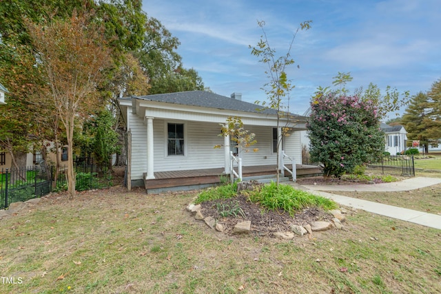 view of front facade with a front lawn and a porch