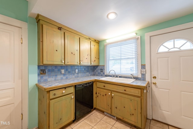 kitchen with sink, light tile patterned floors, dishwasher, and tile counters