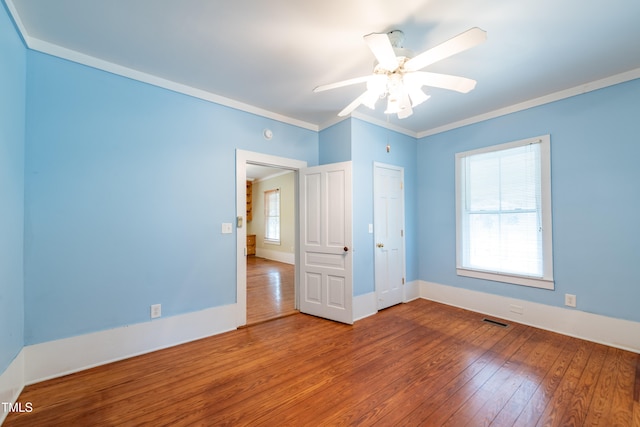 spare room featuring ornamental molding, hardwood / wood-style floors, and ceiling fan