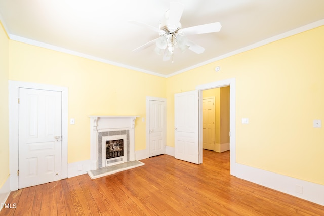 unfurnished living room featuring ornamental molding, light hardwood / wood-style floors, and ceiling fan