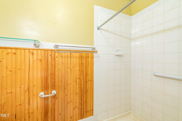 bathroom with tiled shower