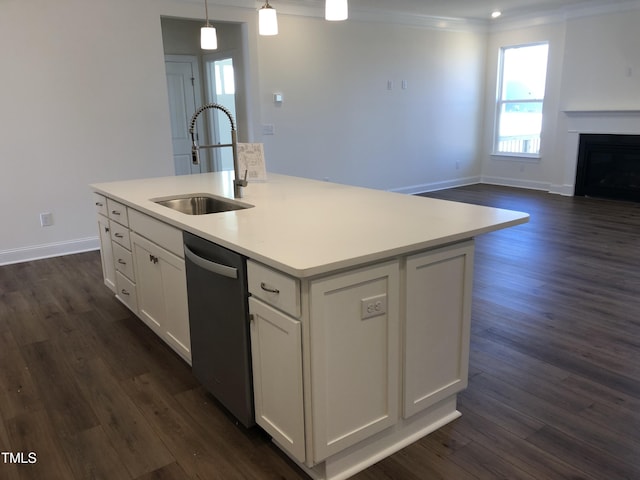 kitchen with dark wood-style floors, a fireplace, white cabinetry, a sink, and dishwasher