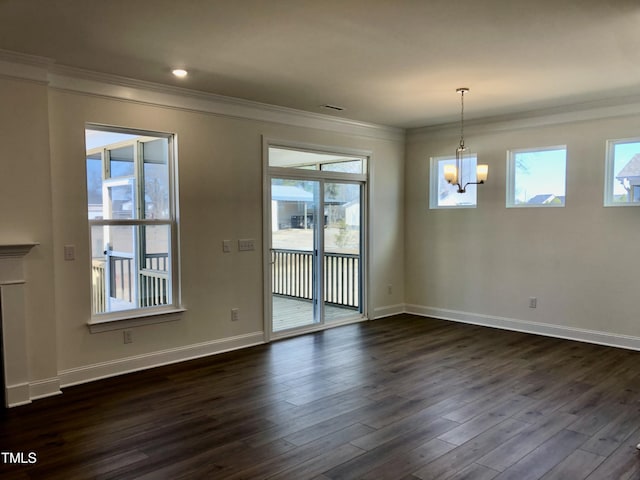 unfurnished dining area featuring dark wood-style floors, a notable chandelier, baseboards, and crown molding