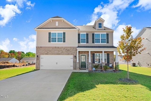 craftsman house with a front lawn and a garage