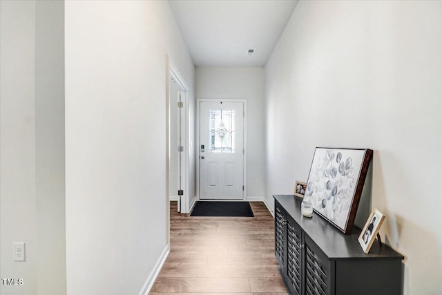 doorway to outside featuring dark hardwood / wood-style flooring