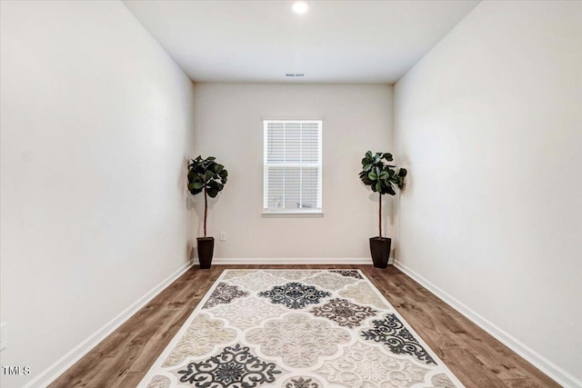 spare room with wood-type flooring