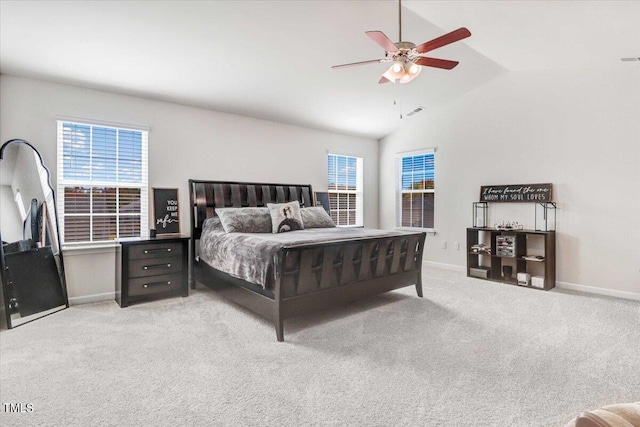 carpeted bedroom with ceiling fan, high vaulted ceiling, and multiple windows