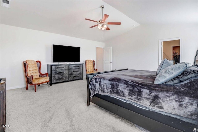 carpeted bedroom with ceiling fan and vaulted ceiling