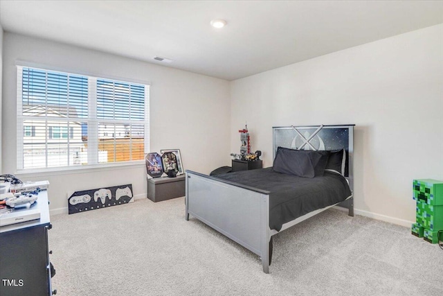 bedroom featuring light colored carpet