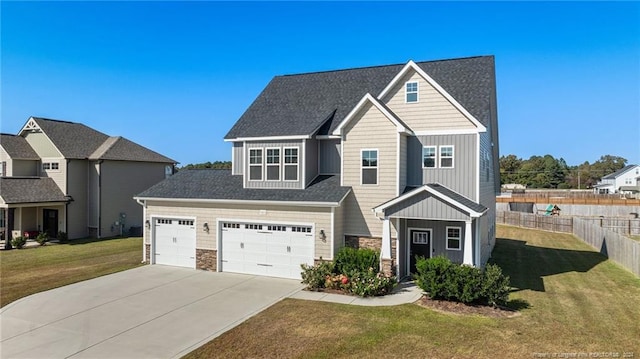 view of front facade featuring a garage and a front lawn