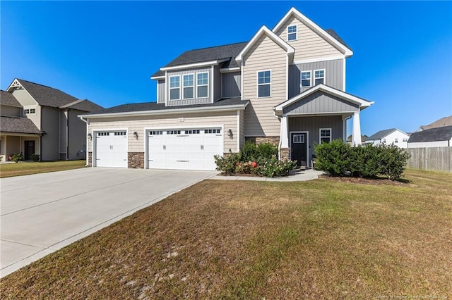 view of front of property featuring a front lawn and a garage