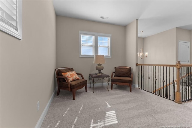 sitting room featuring carpet flooring, visible vents, a chandelier, and baseboards