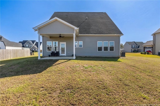 back of property featuring fence, a patio, central air condition unit, a lawn, and a ceiling fan