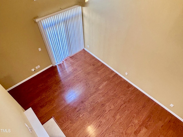 spare room featuring hardwood / wood-style flooring