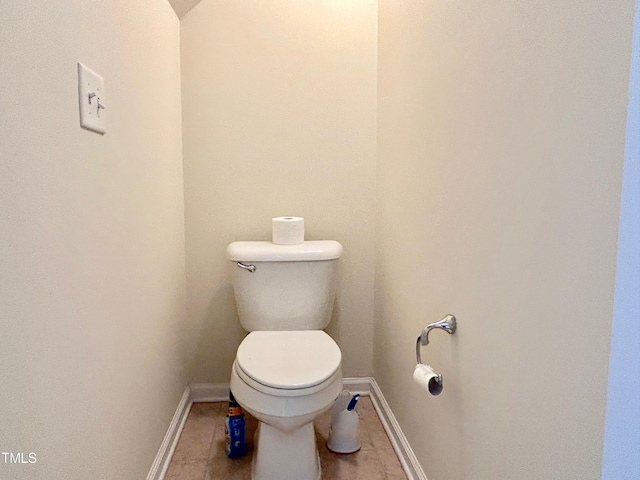 bathroom featuring tile patterned floors and toilet