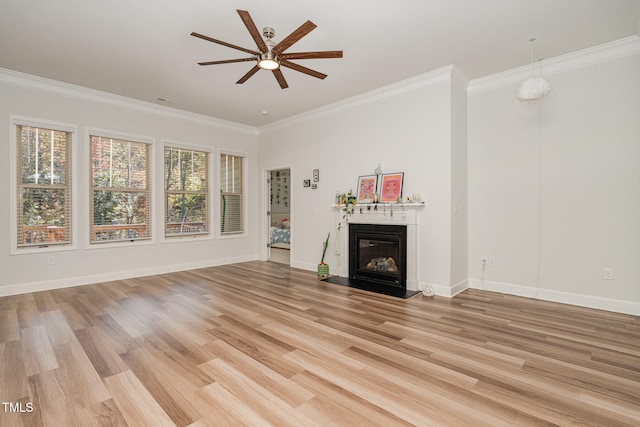 unfurnished living room featuring light hardwood / wood-style flooring, ornamental molding, and ceiling fan