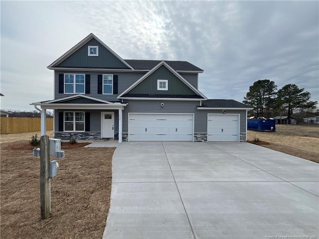 craftsman-style house featuring a garage and a porch