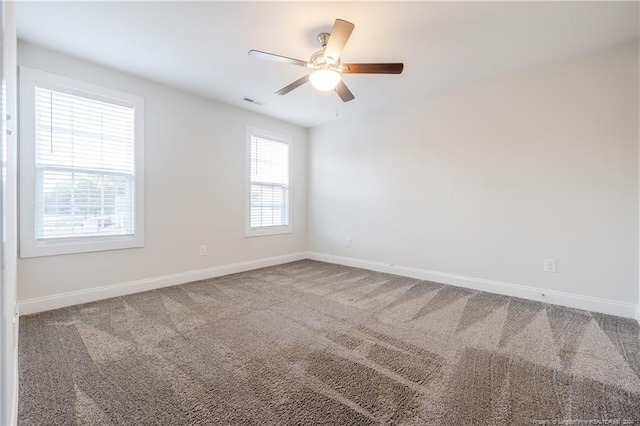 spare room with ceiling fan and carpet flooring