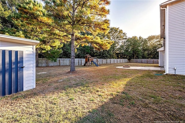 view of yard featuring a patio area and a playground