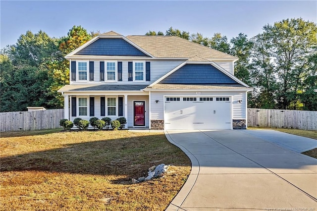 400 Jax Ct, Fayetteville, NC 28312 - craftsman-style house with driveway, a garage, and stone siding