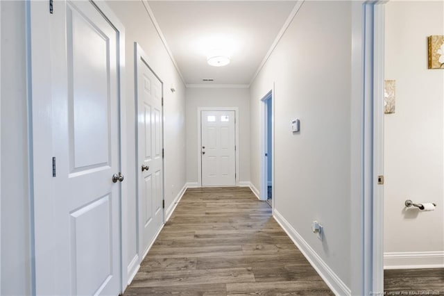 400 Jax Ct, Fayetteville, NC 28312 - doorway featuring wood finished floors, crown molding, and baseboards