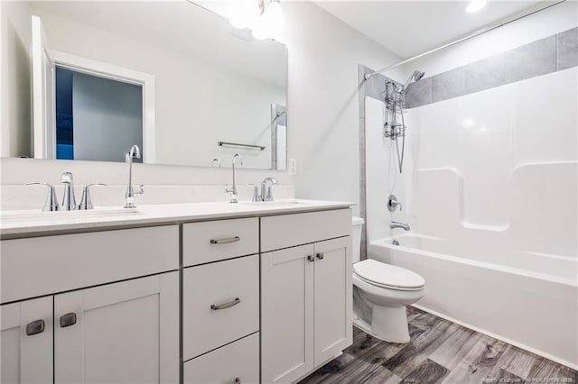 400 Jax Ct, Fayetteville, NC 28312 - full bathroom featuring toilet, double vanity, shower / bathtub combination, and wood finished floors