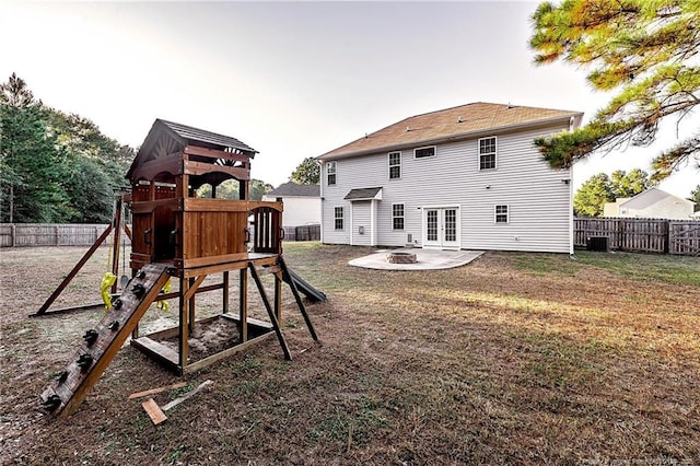 400 Jax Ct, Fayetteville, NC 28312 - rear view of property featuring a playground, a fire pit, central AC unit, a patio area, and french doors