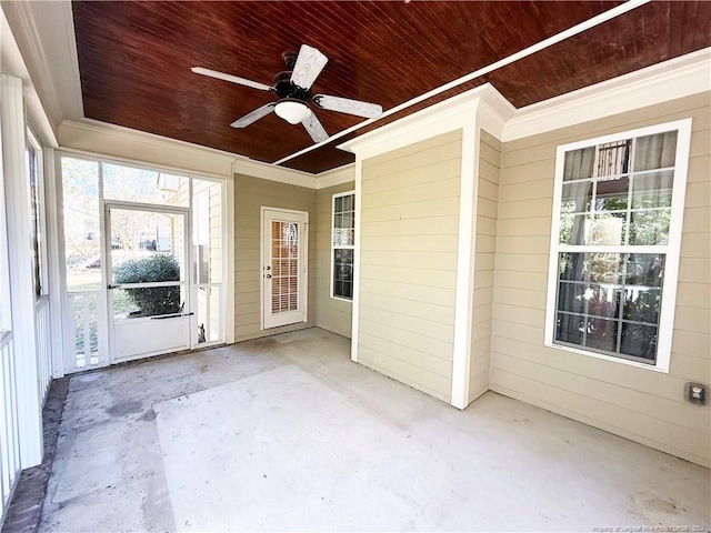 unfurnished sunroom featuring ceiling fan and wooden ceiling