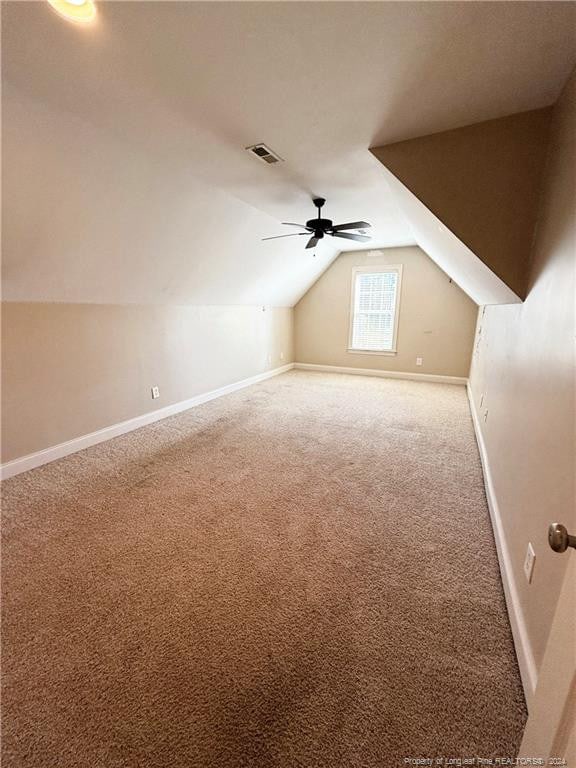 bonus room featuring carpet, vaulted ceiling, and ceiling fan