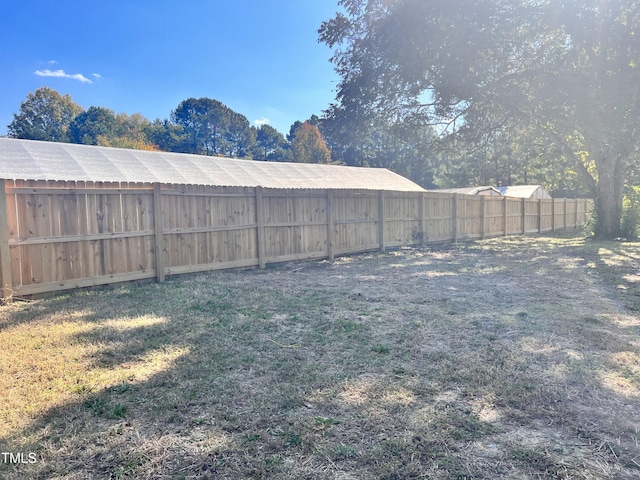 view of yard with a fenced backyard