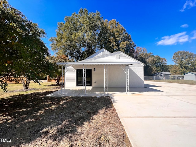 rear view of house featuring a patio