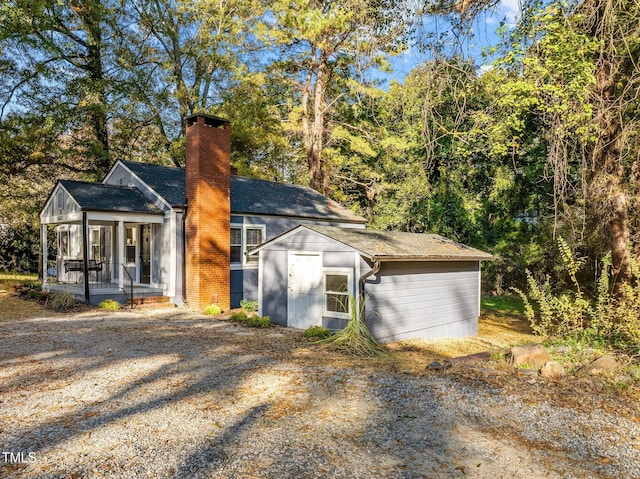 view of front of house with a sunroom