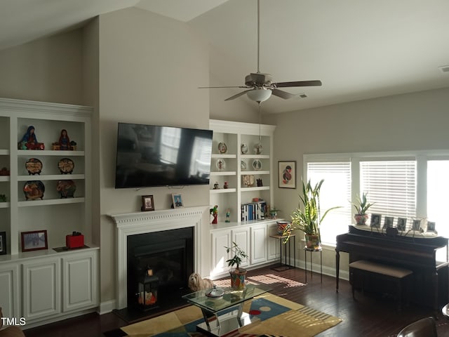 living room with ceiling fan, high vaulted ceiling, and dark hardwood / wood-style flooring