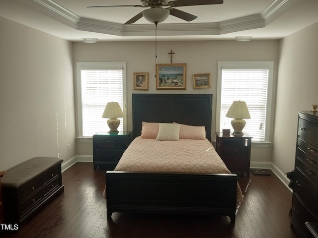 bedroom with ceiling fan, multiple windows, and dark hardwood / wood-style flooring