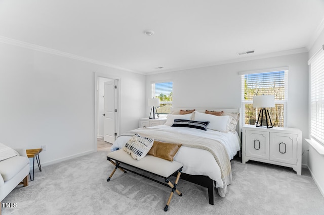 bedroom featuring visible vents, light carpet, baseboards, and ornamental molding